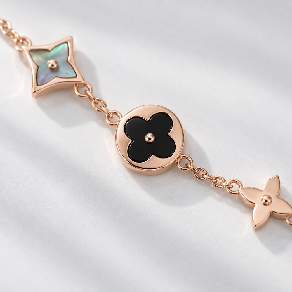 Lắc tay Four Leaf Flower vàng hồng đen 2020RG.BL - cận charm hoa đen và sao xà cừ
