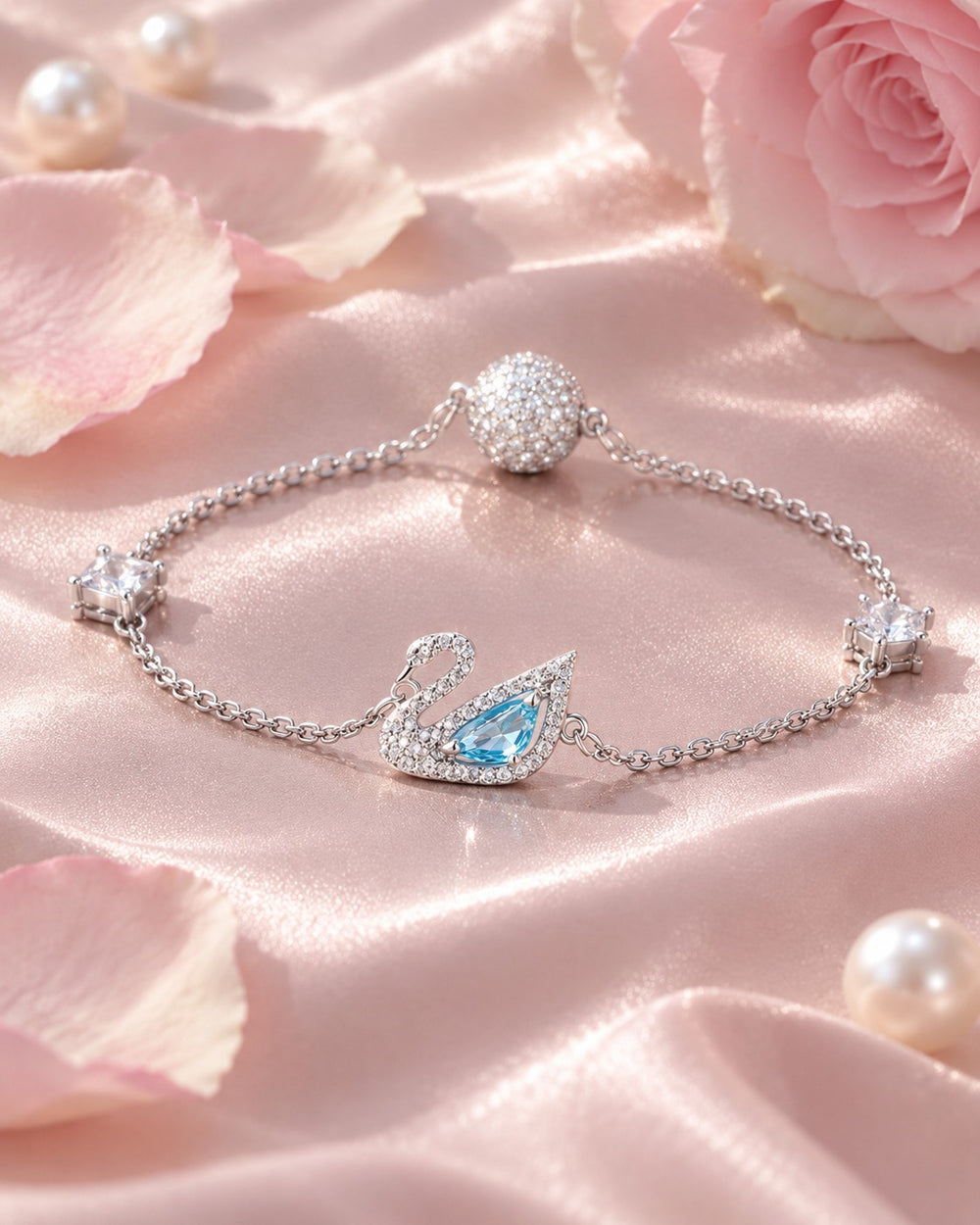 Dazzling Swan Bracelet Silver trên lụa hồng cùng ngọc trai và hoa hồng
