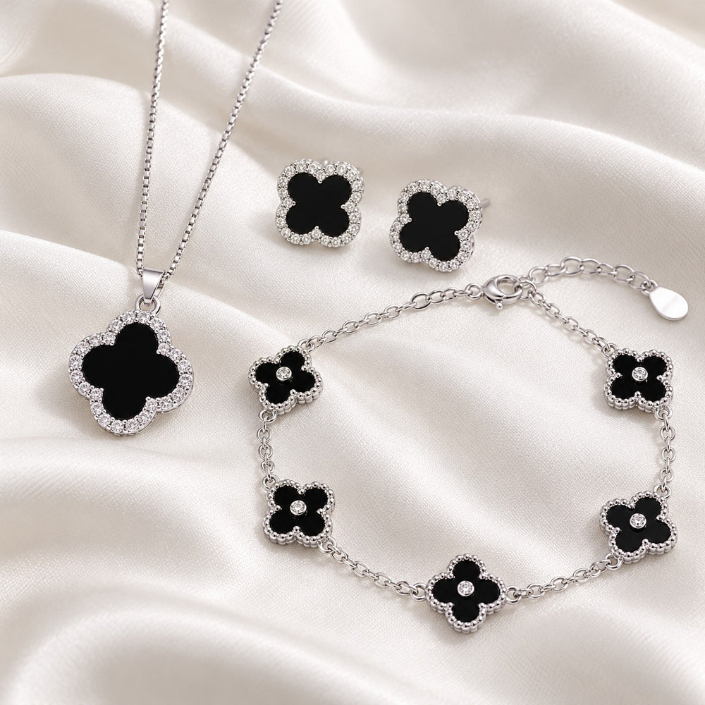 Cận cỏ đen viền đá và lắc 5 cỏ bộ Four Leaf