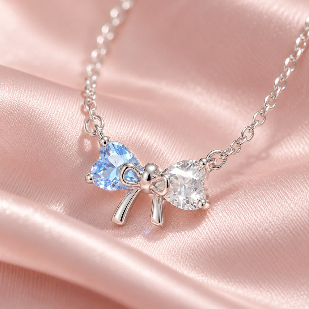 Cận nơ 2 đá tim xanh và trắng dây chuyền 6325BE