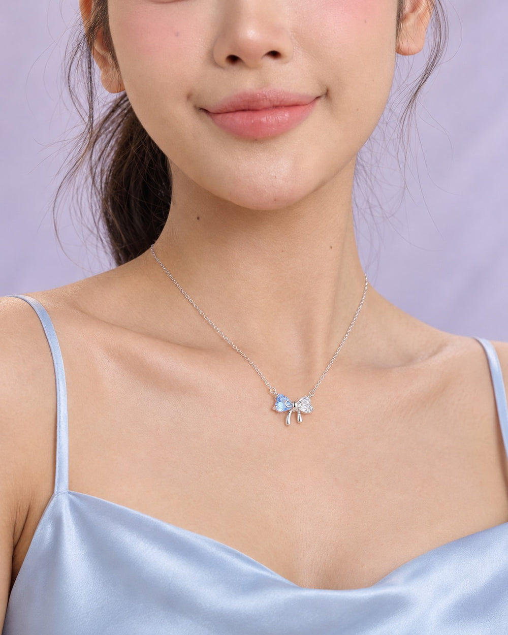 Dây chuyền nơ pha lê xanh 6325BE khi đeo