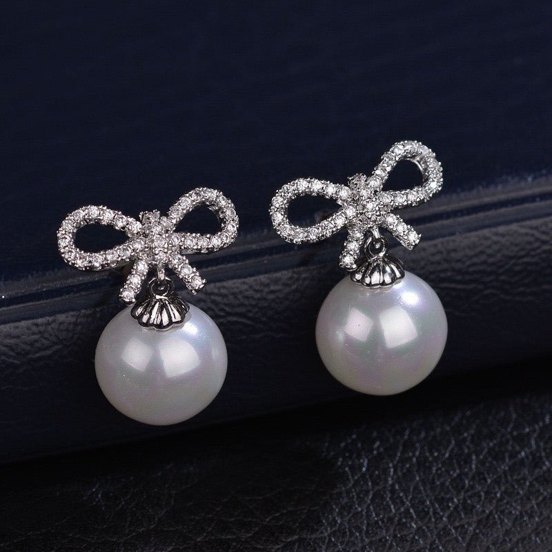 Bow-shaped and Synthetic Pearl Earrings - 3101SV
